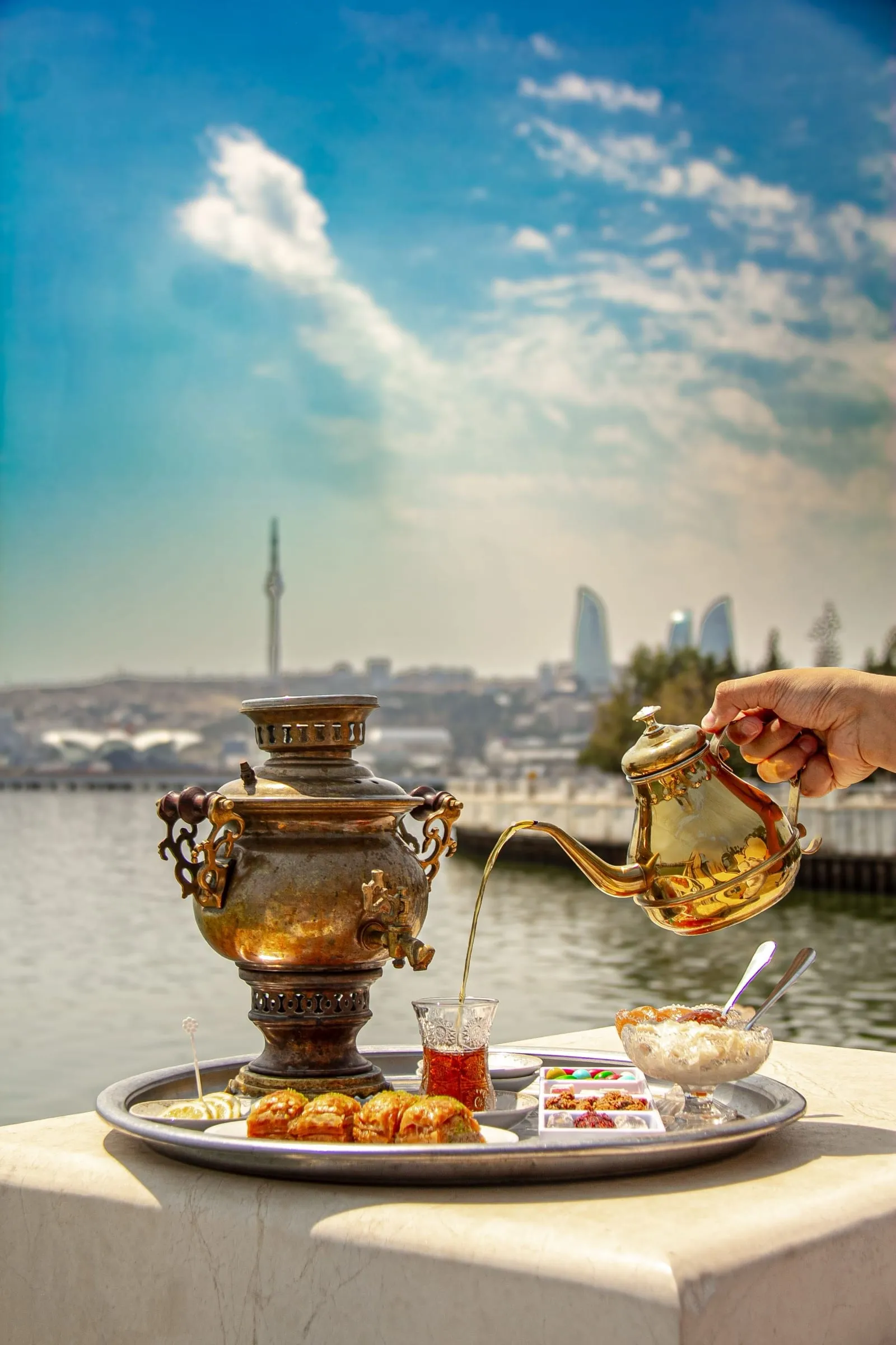 Azerbaijani tea poured above the Baku skyline